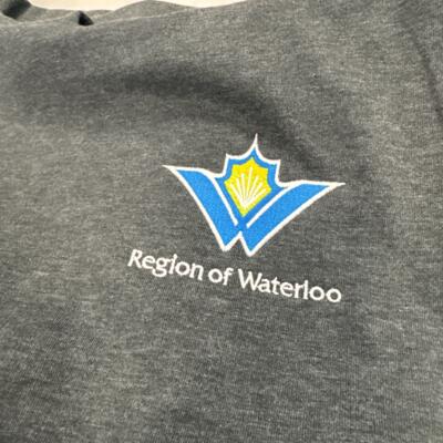 Custom printed construction-company apparel produced by By L.A.W. Designs in Waterloo