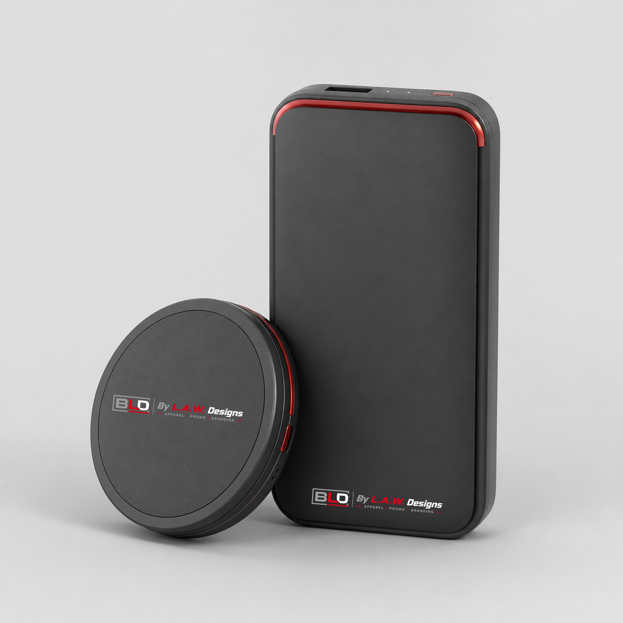 Black promotional wireless charger and power bank decorated with the official BLD logo